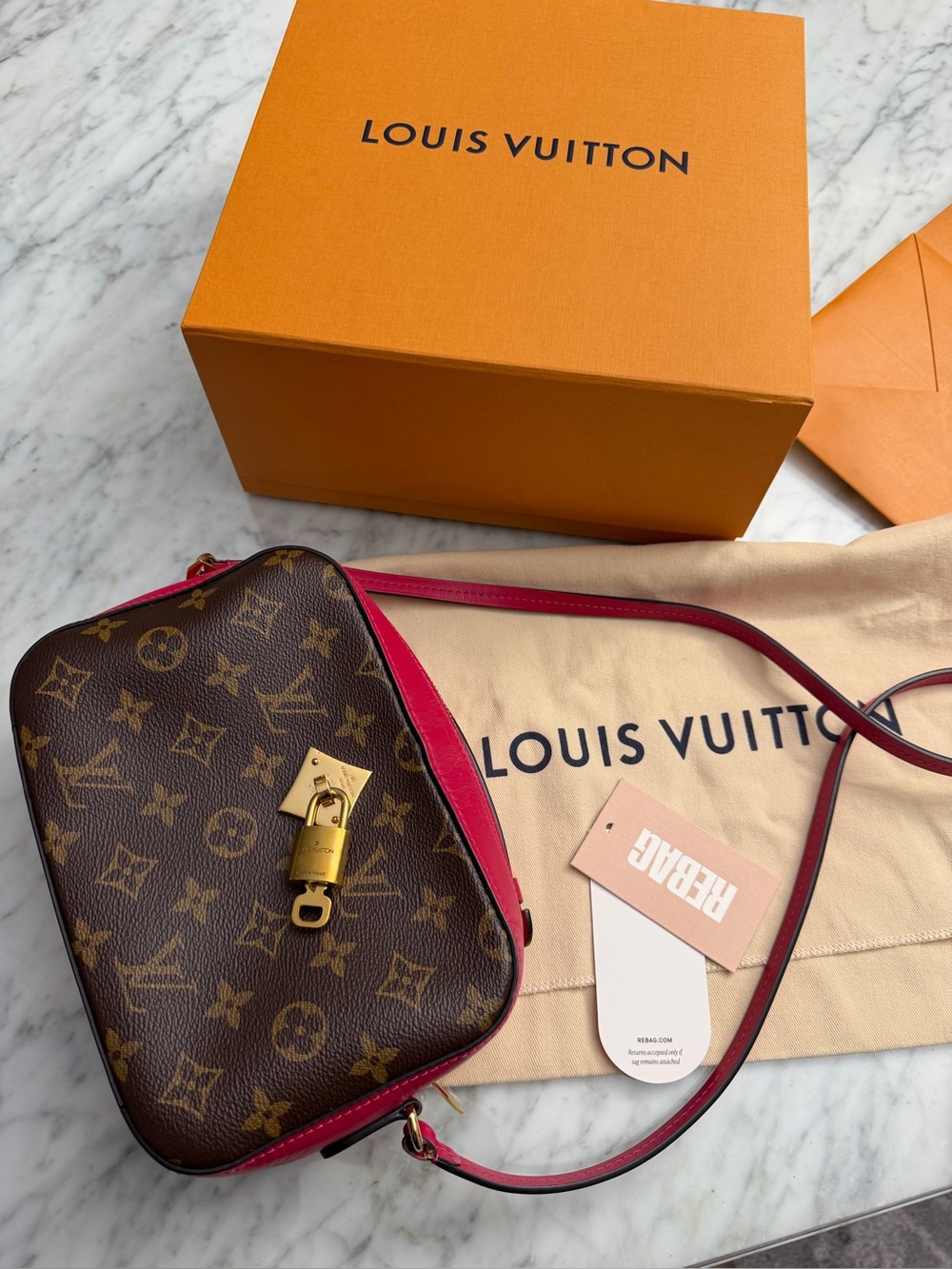 LOUIS VUITTON Saintonge crossbody Bag Monogram Freesia with removable lock key